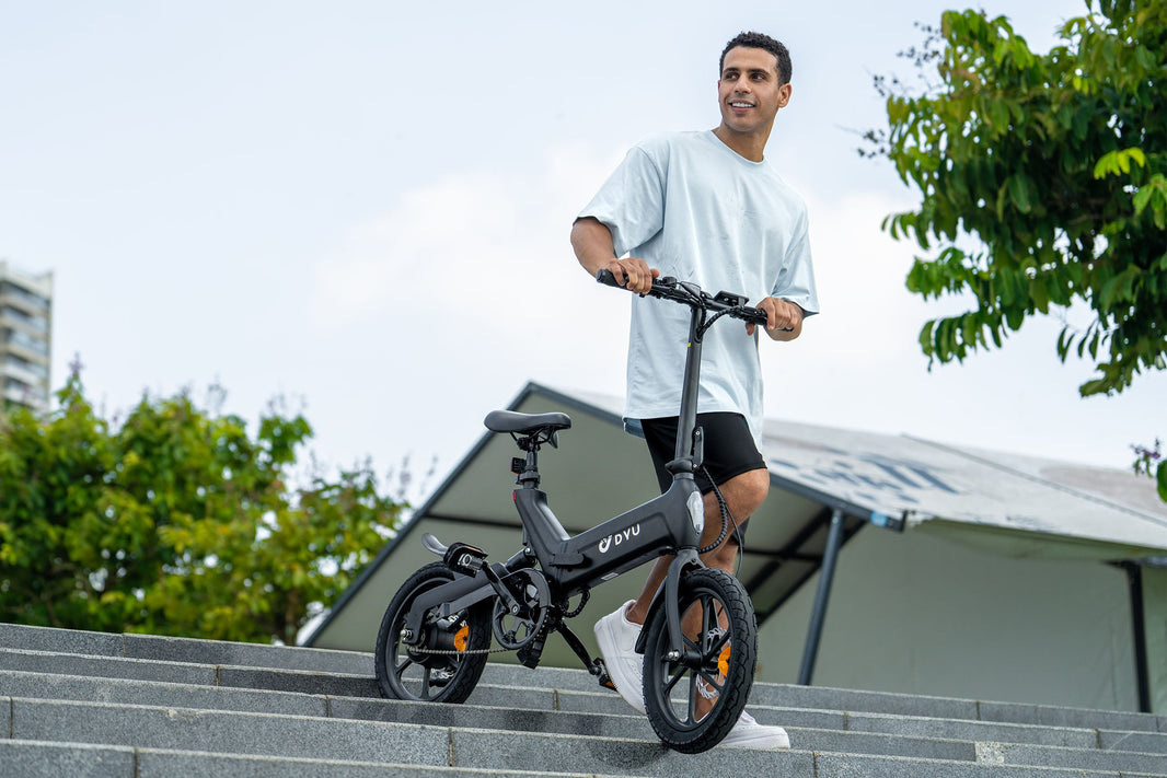 The fashionable boy pushed the DYU EBIKE A16 down the stairs
