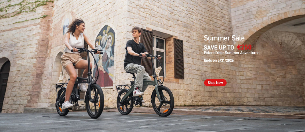 DYU T1 folding e-bikes with riders on a park path for the Summer Sale