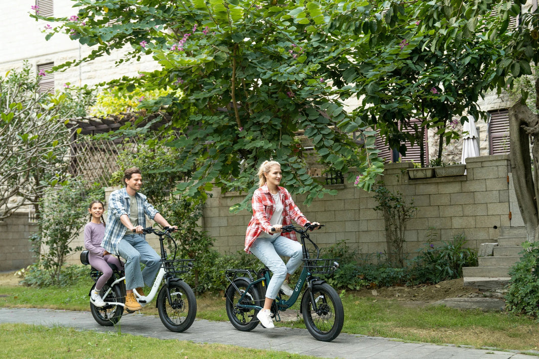 DYU C9 folding e-bikes on a garden path for a European weekend route