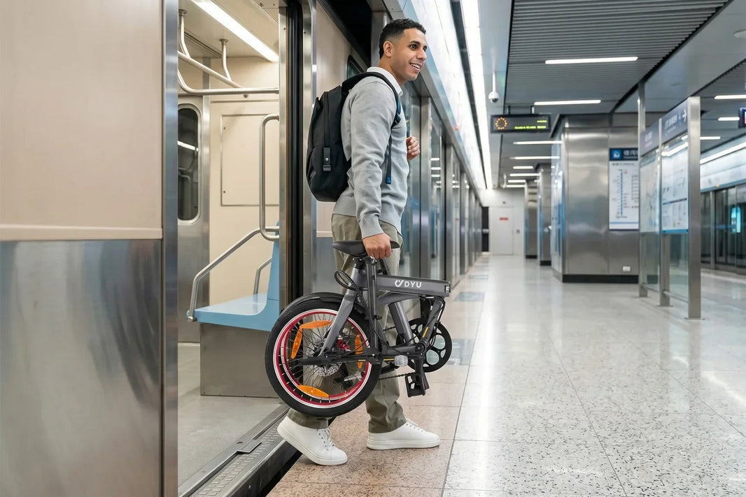 DYU SP1 lightweight folding e-bike pushed folded on a European station platform
